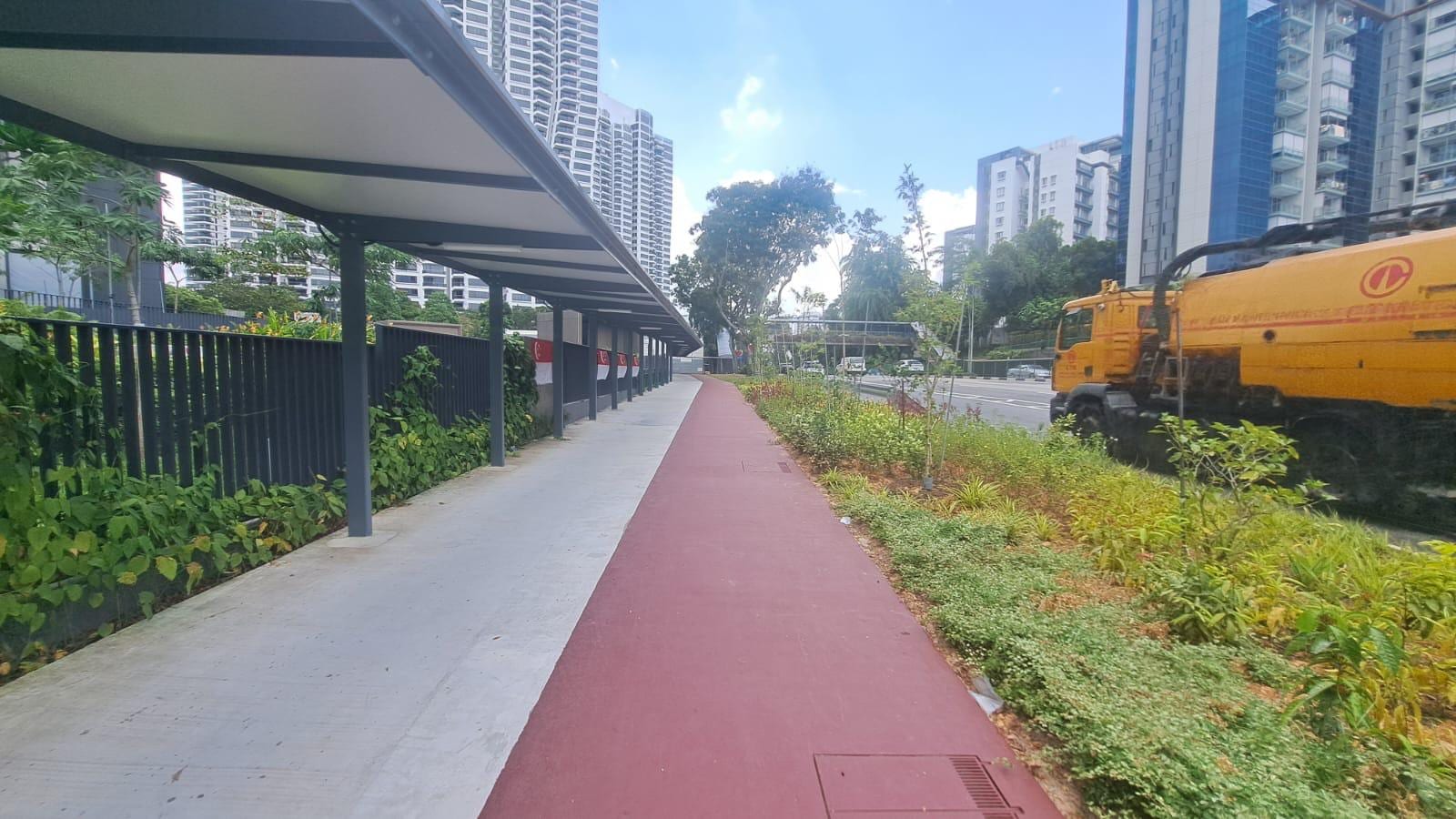 Completed footpath, cycling path and bus shelter works as part of integrated commuter infrastructure.